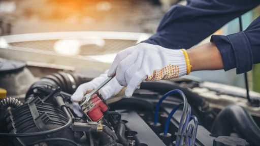 How to take care of your car engine – Mechanic working on a car engine