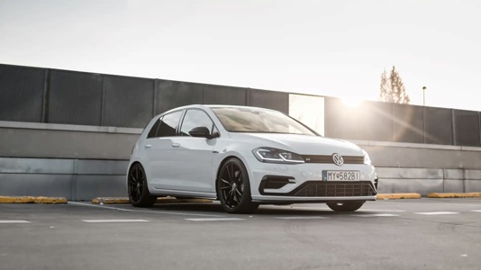 What is the best hatchback – A white hatchback in a parking lot